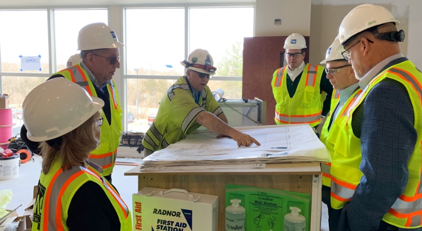TMG Construction team reviewing plans